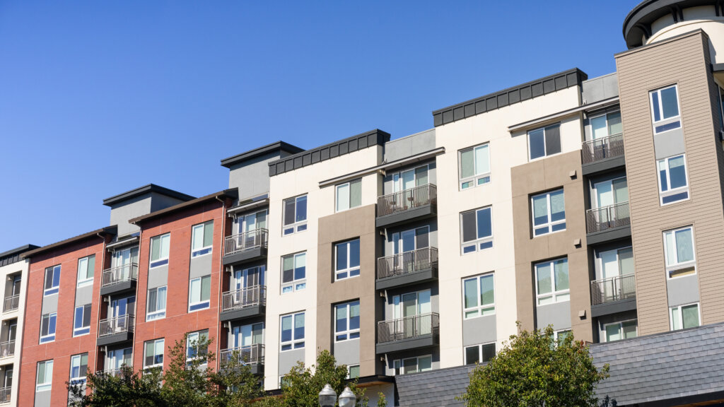 Apartment building exterior representing a stabilized multifamily asset moving from bridge debt to permanent financing